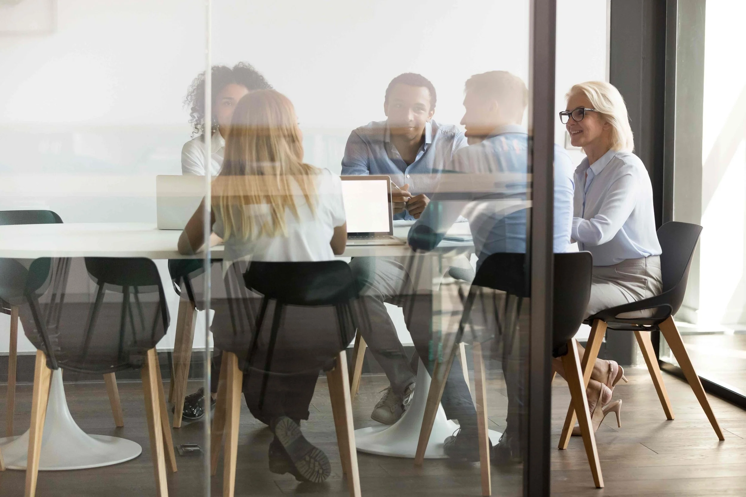 Image of people meeting in a board room