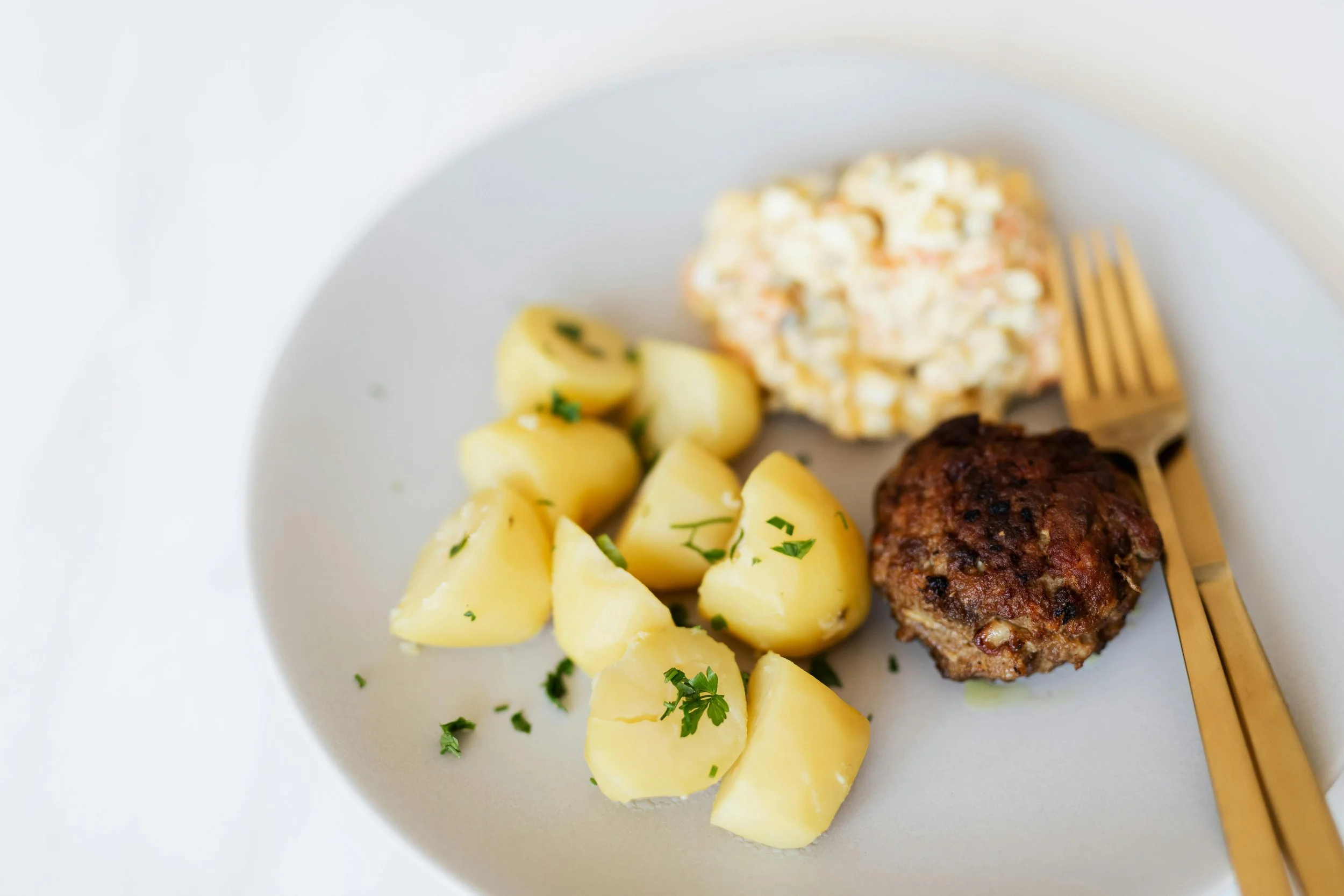 Meat, potato, cauliflower on a plate