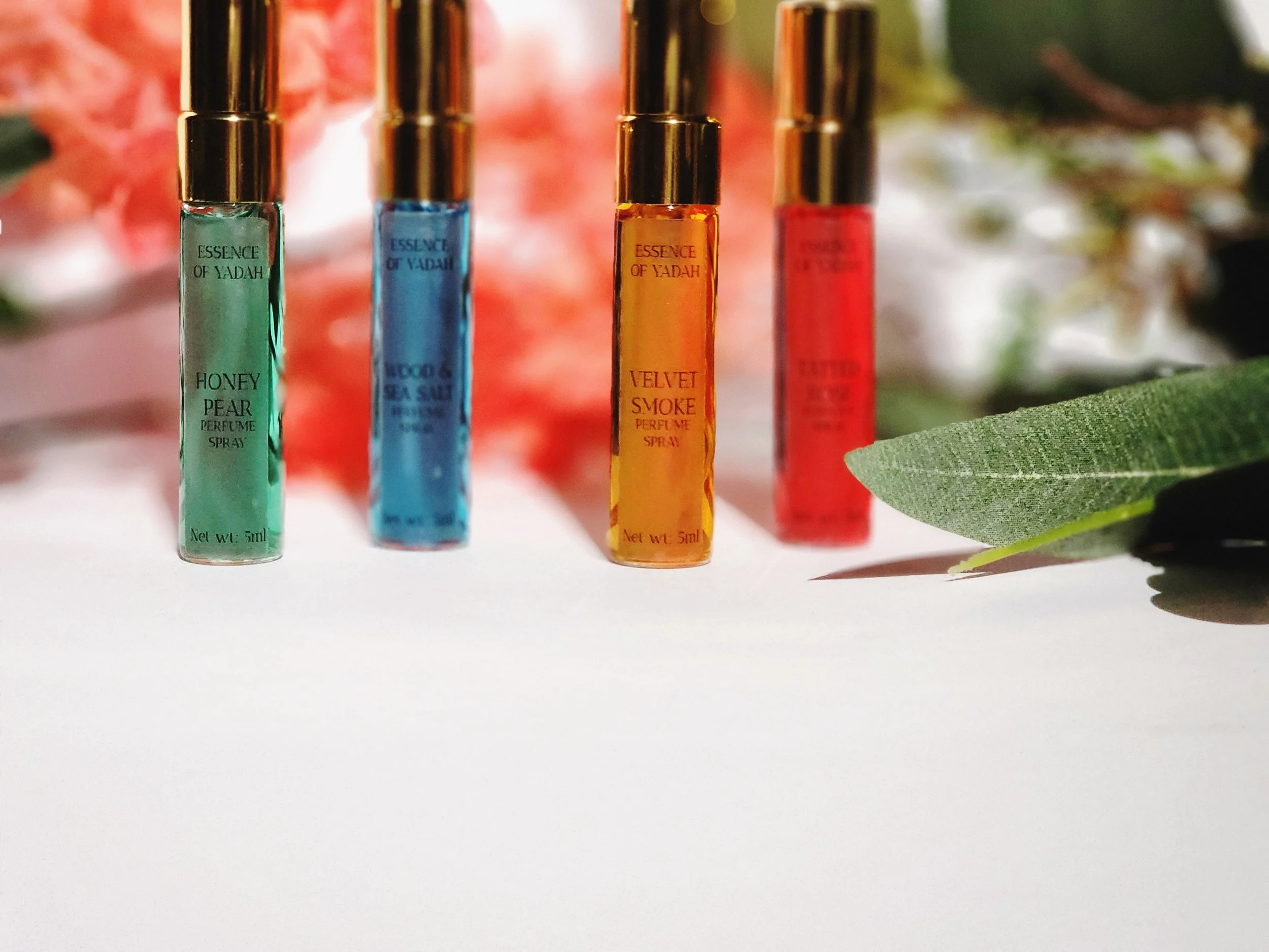 unplugged 5ml set white background with orange flowers ESSENCEOFYADAH.jpg