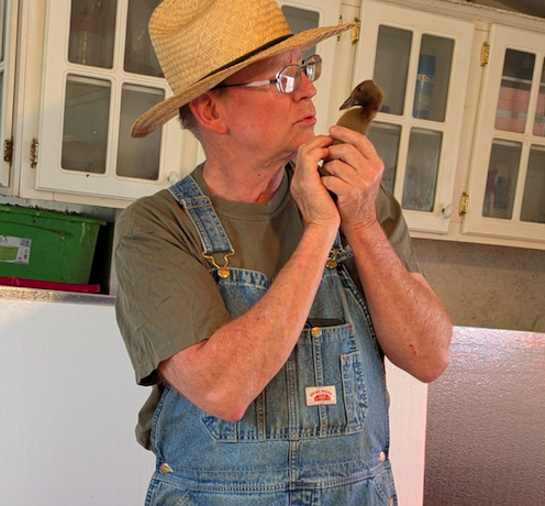 Bryan with duckling cropped.png