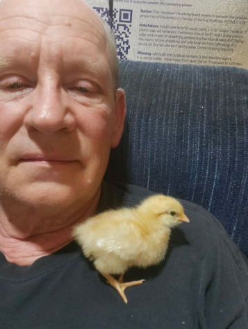 Bryan_with_baby_chick_spring2024.png