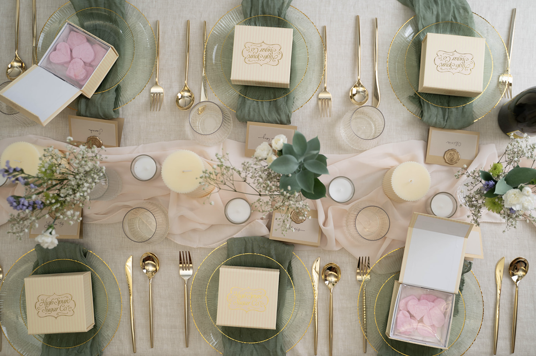 Elegant tablescape featuring High Spun Sugar Co products, gold silverware, and gold rimmed plates