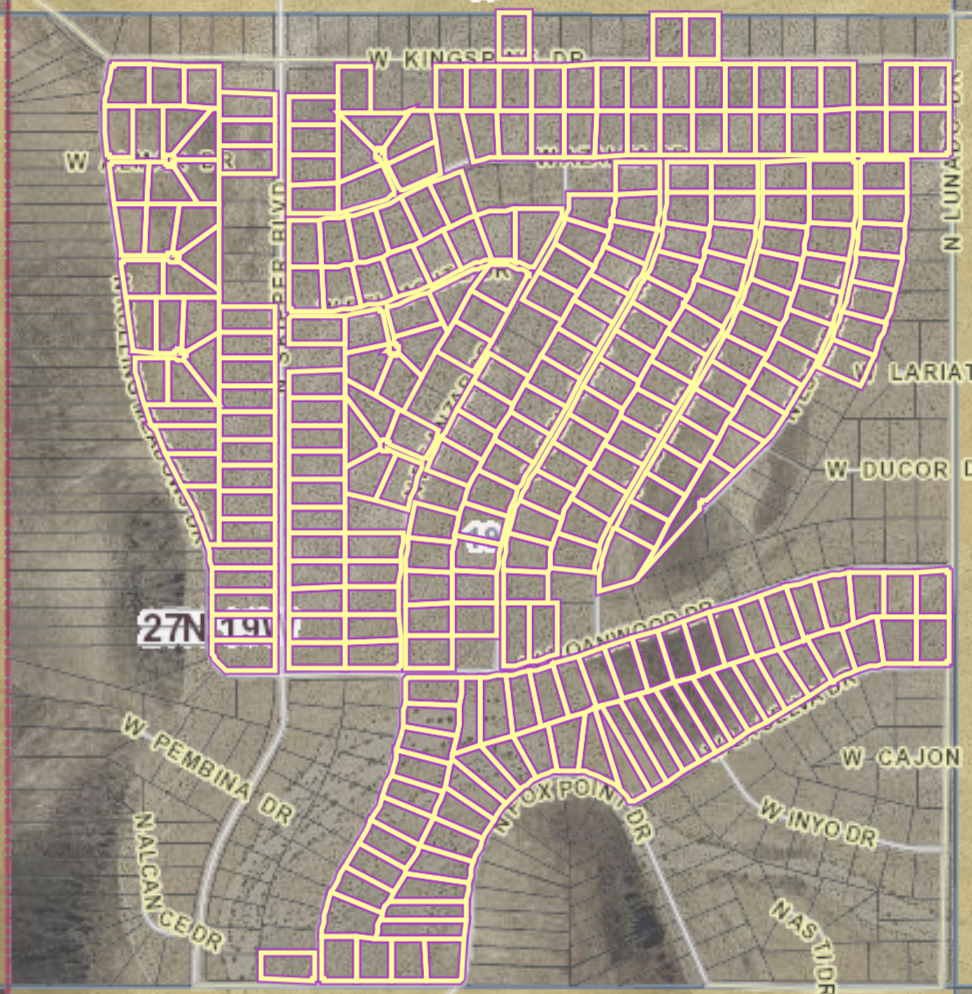 Map displaying a neighborhood with streets outlined in purple. Streets include W Kings Dr, N LUNA, W Cajon, W INYO, and others, with a section of residential plots and some labeled streets.
