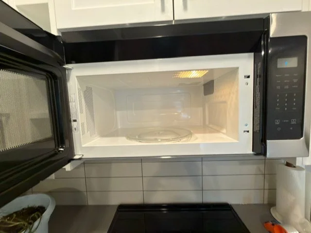Interior microwave cleaned and sanitized grease and buildup, serviced by AAE Home Glow in Calgary.