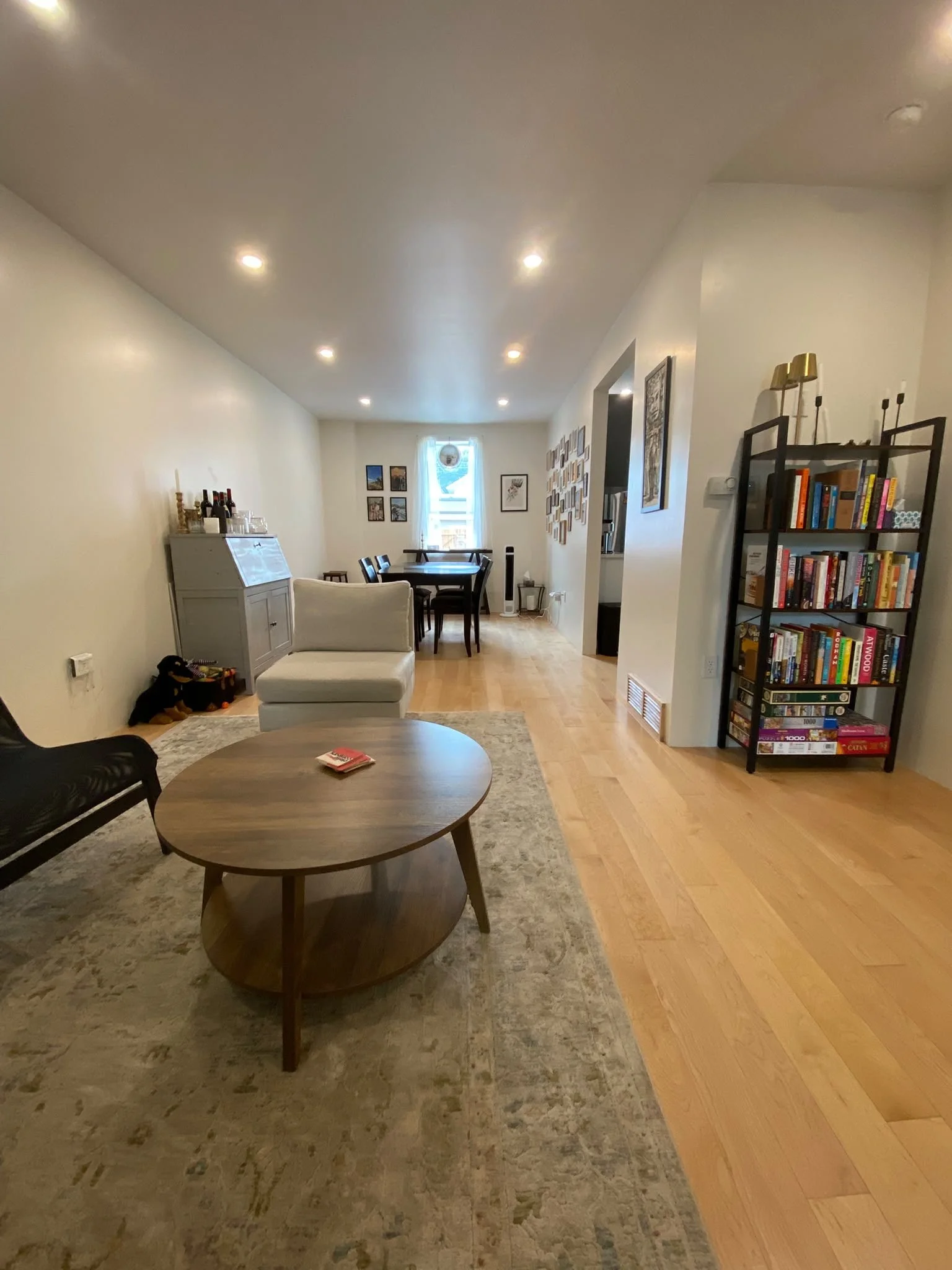 Cozy living space with vacuumed rugs and streak-free windows, cleaned by AAE Home Glow.