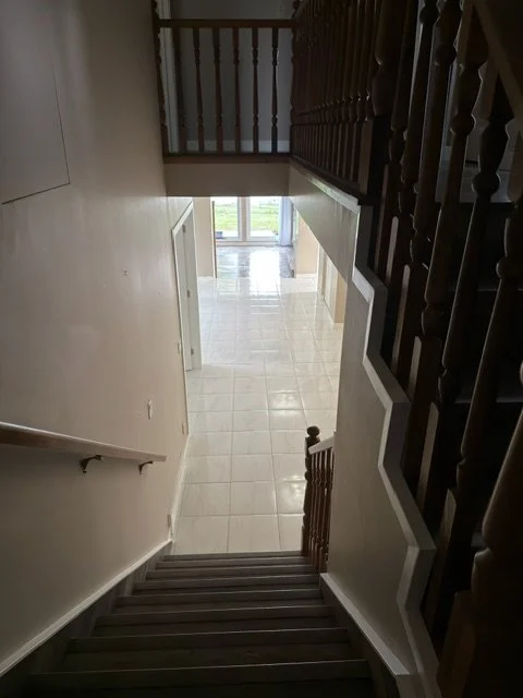 Hardwood staircase polished and cleaned as part of a whole-home service by AAE Home Glow.