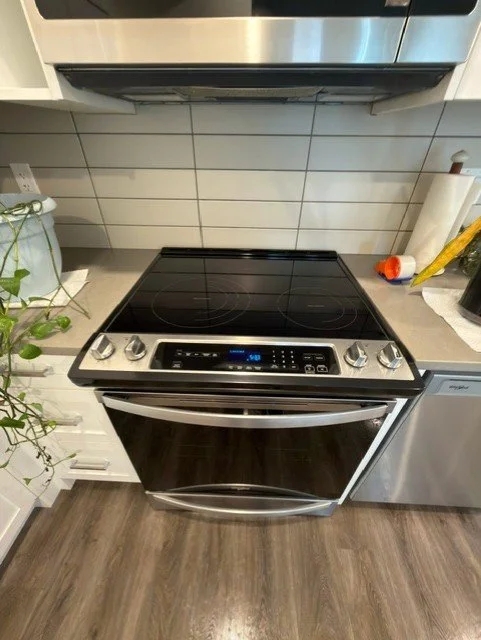 Stovetop and oven interior professionally degreased and sanitized by AAE Home Glow's cleaning team.