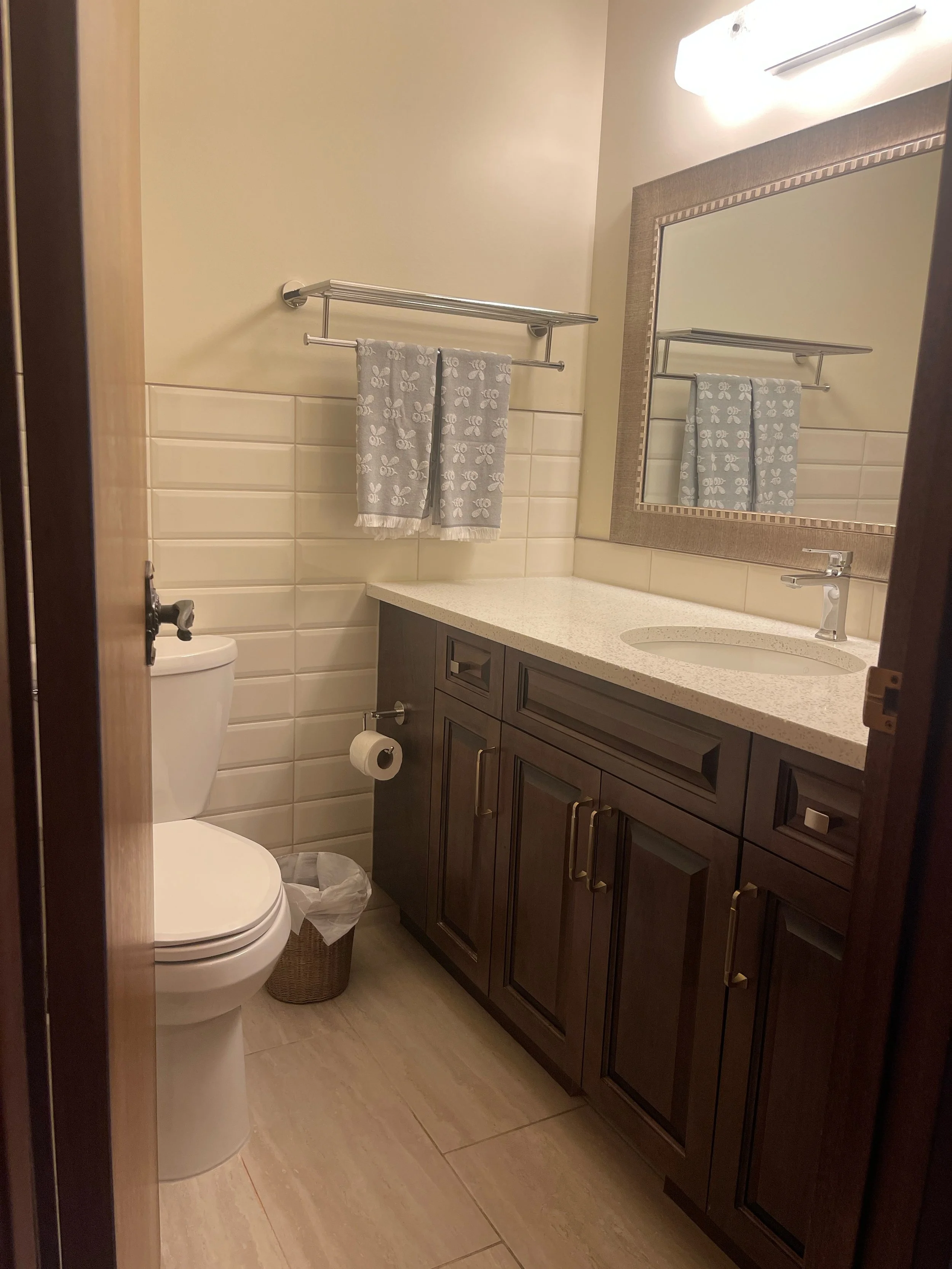 Deep-cleaned bathroom with a disinfected tub and shower, part of AAE Home Glow's residential cleaning service.