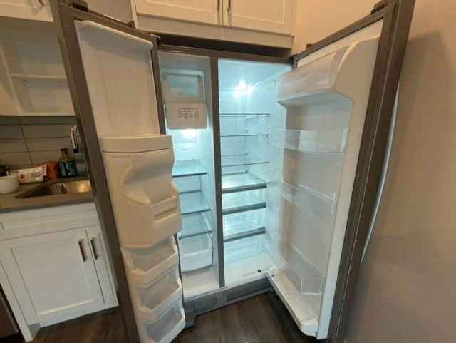 Clean, sanitized refrigerator interior after a detailed appliance cleaning by AAE Home Glow.