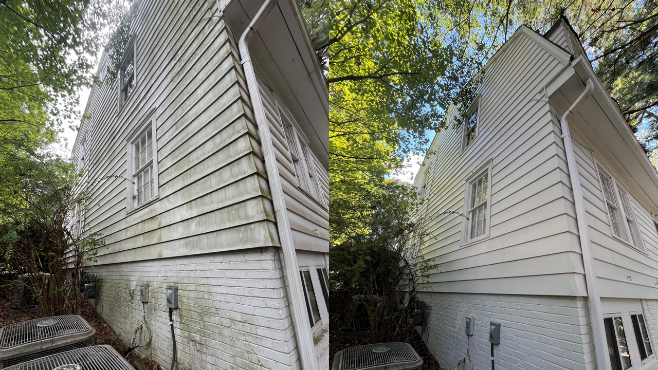 Before and after images of house washing, showing a house with siding and brick foundation, with the left side appearing dirty and the right side clean.