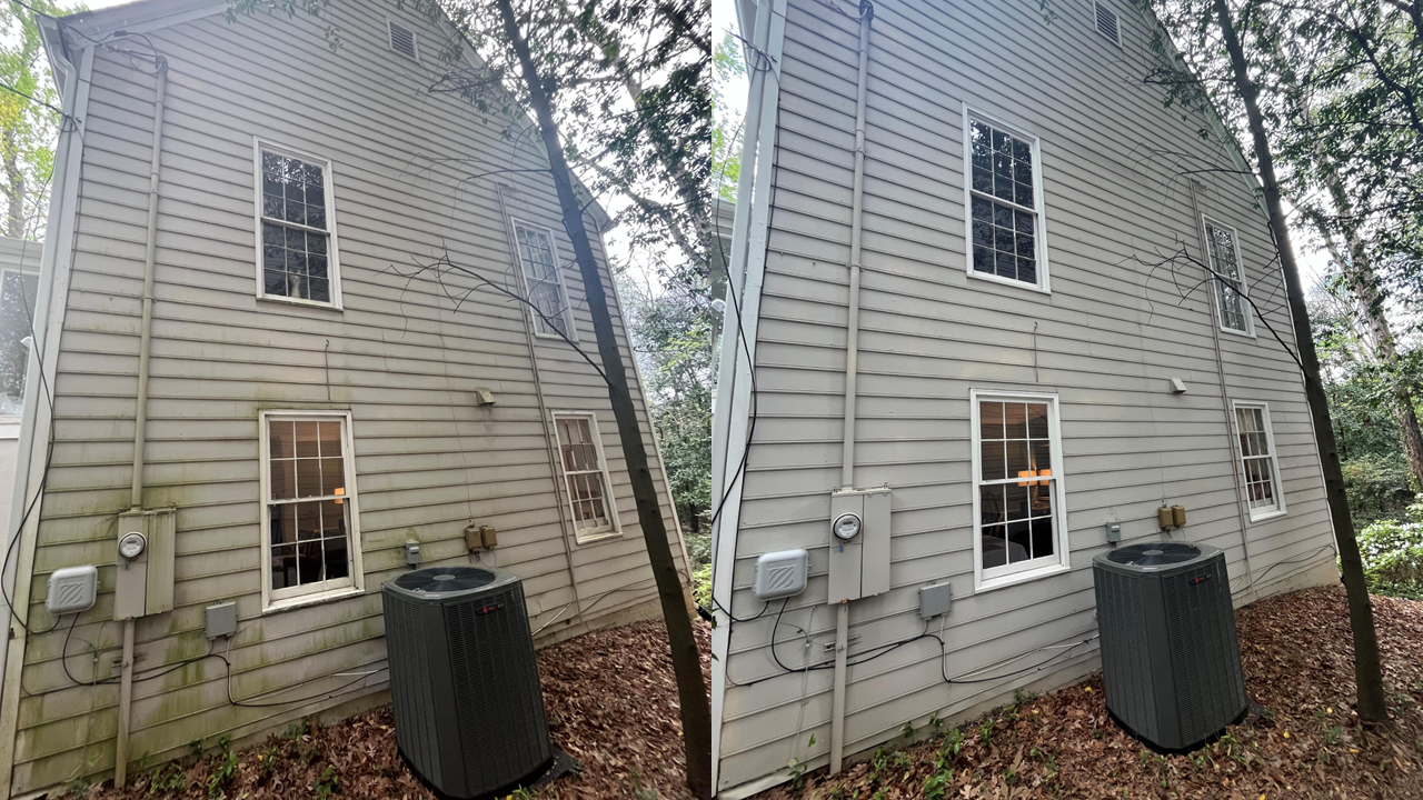 Side-by-side images of the same house exterior showing before and after soft washing. The house has vinyl siding, four windows, an air conditioning unit. The left image shows dirty, moldy siding; the right shows clean siding.
