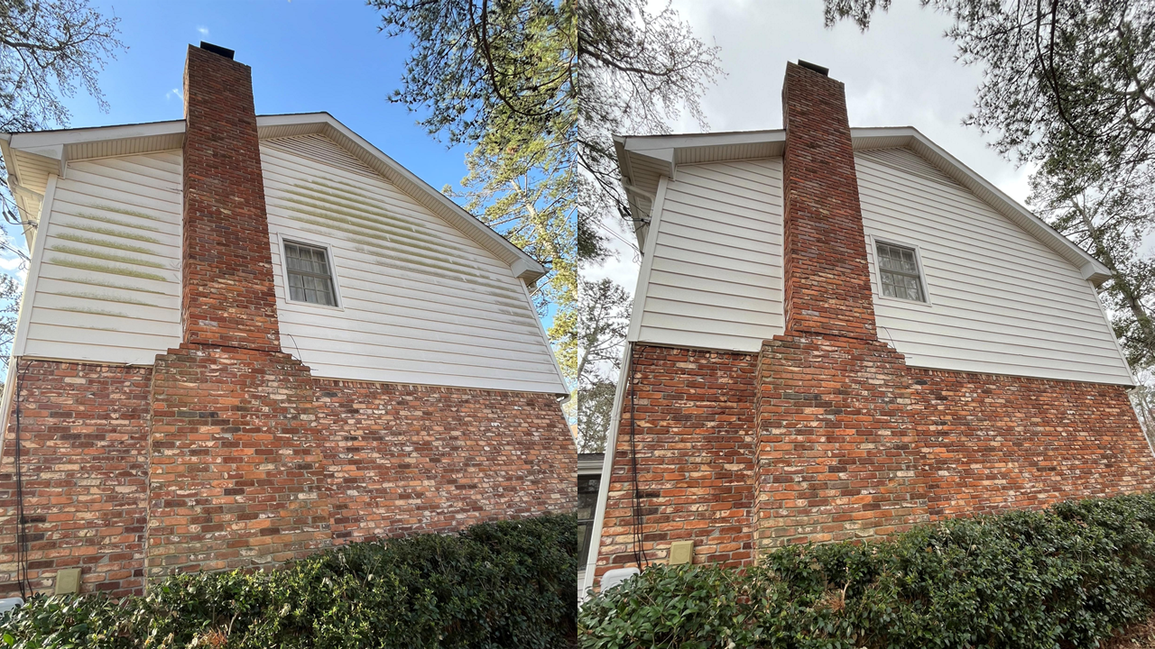 Side-by-side comparison of a brick chimney on a house before and after cleaning, showing less moss and dirt after cleaning.