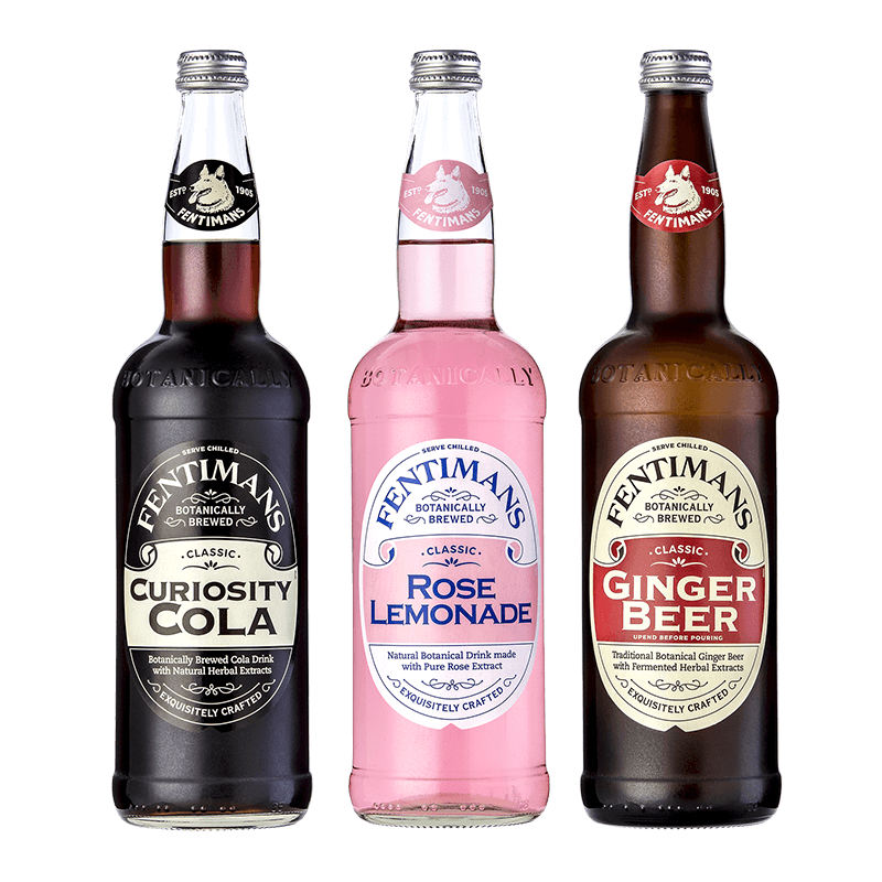 Three bottles of Fentimans botanical drinks, including Curiosity Cola, Rose Lemonade, and Ginger Beer, arranged side by side on a black background.