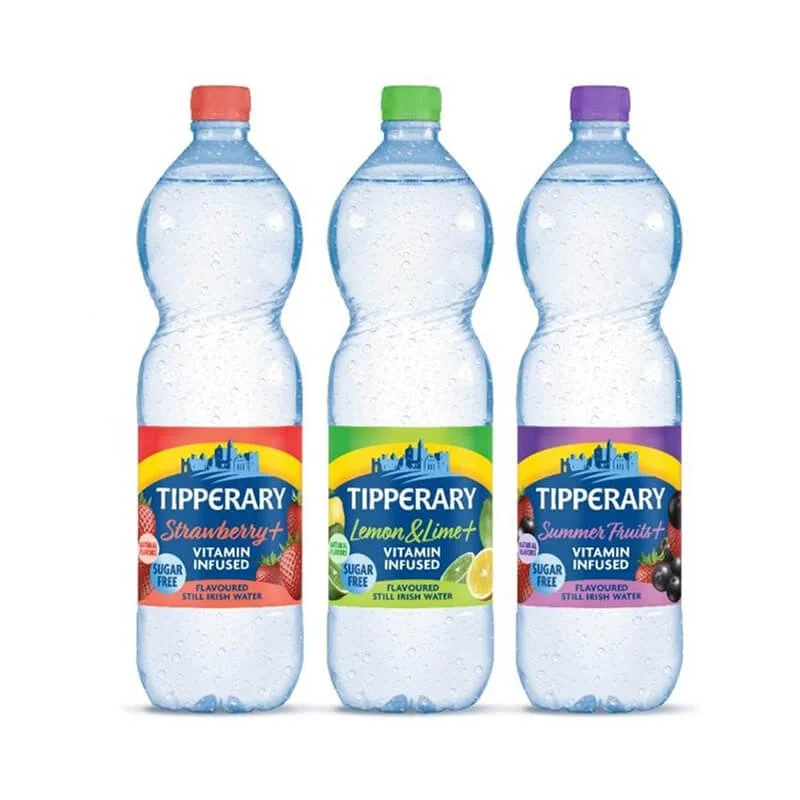 Three bottles of flavored still Irish spring water from Tipperary, each with a different fruit flavor: strawberry, lemon & lime, and summer fruits.