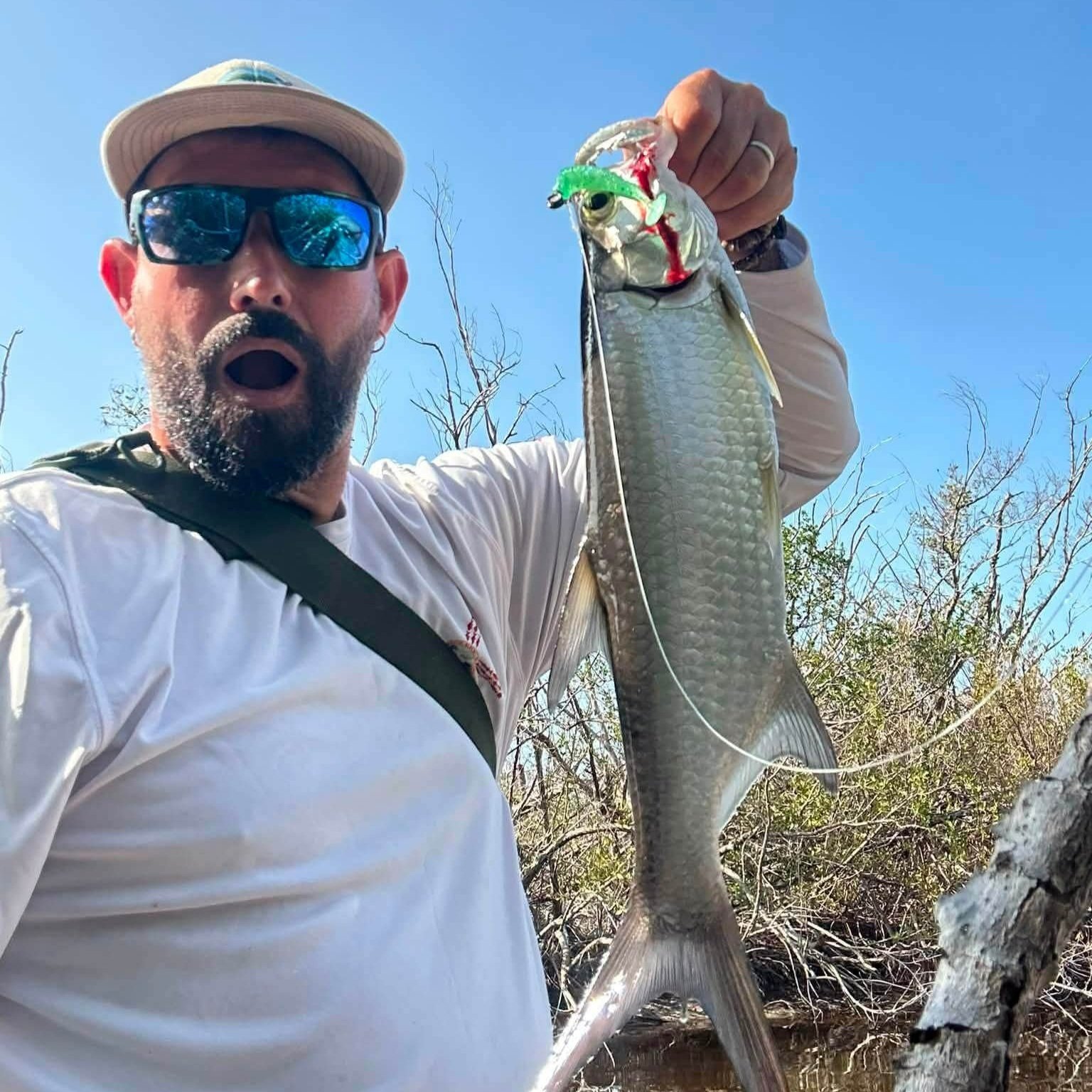 snook+being+held+after+caught+on+3+inch+paddletail+by+limit+out+lure.jpg