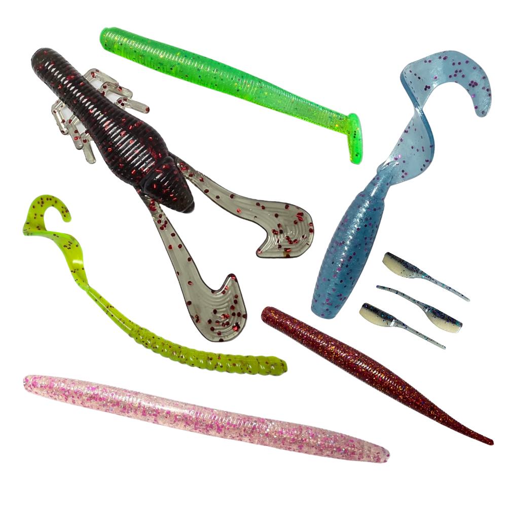 Multiple soft plastic fishing worms in various colors including green, black, gray, yellow, pink, and red with glitter and speckles for bass, trout, crappie, walleye and much more freshwater fishing.