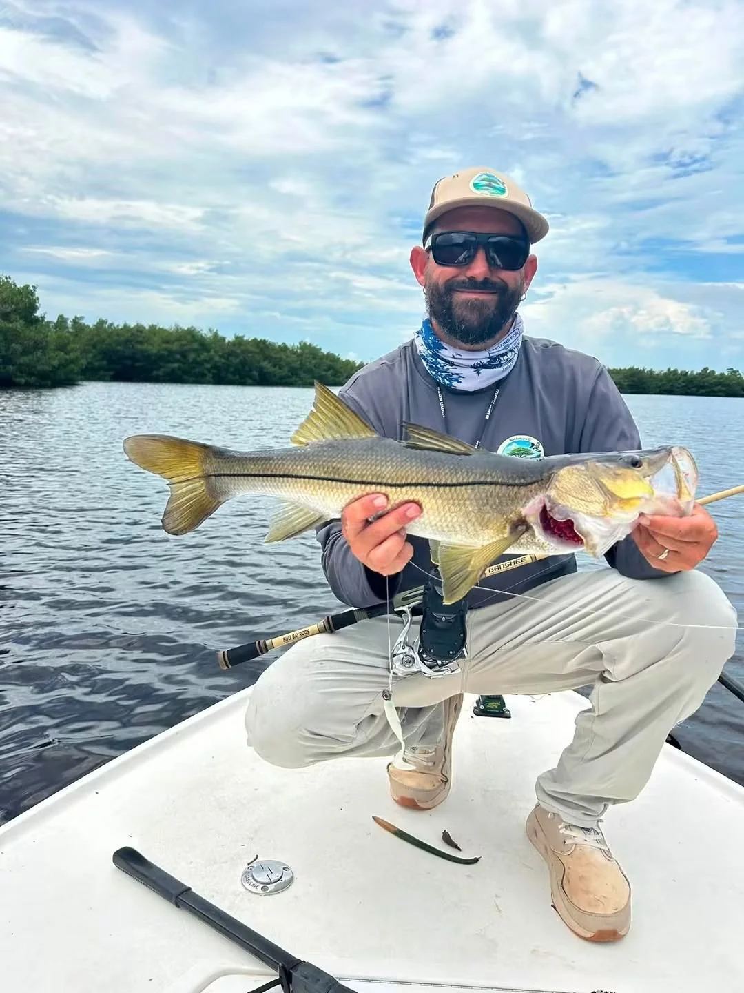 angler holding a snook Caught in Ft. Myers, Fl on Limit out lures Soft plastic Bait