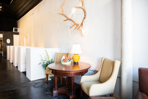 A rustic-industrial co-working space in the Creative Covey, featuring a distinct antler wall