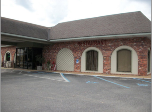 The Plaza Restaurant & Oyster Bar property featuring classic brick architecture and arched windows