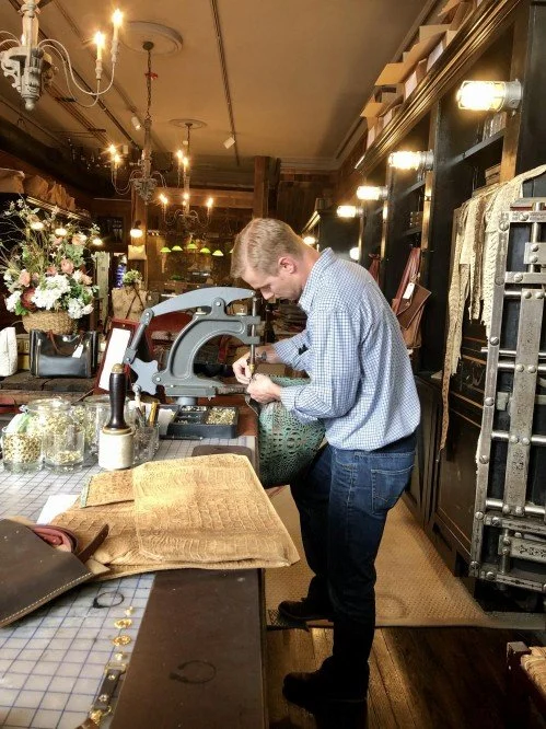 A craftsman working on a project inside a workshop