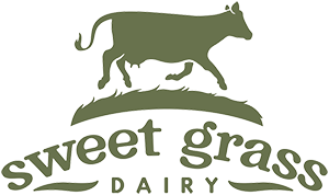 Cow silhouette walking on green grass above the text "sweet grass DAIRY"