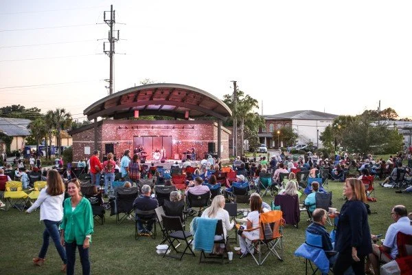 A lively outdoor concert held on a First Friday at The Ritz Amphitheater in downtown Thomasville, GA