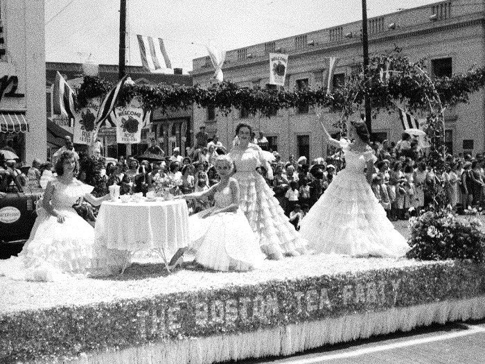 A group of women riding in the rose festival parade