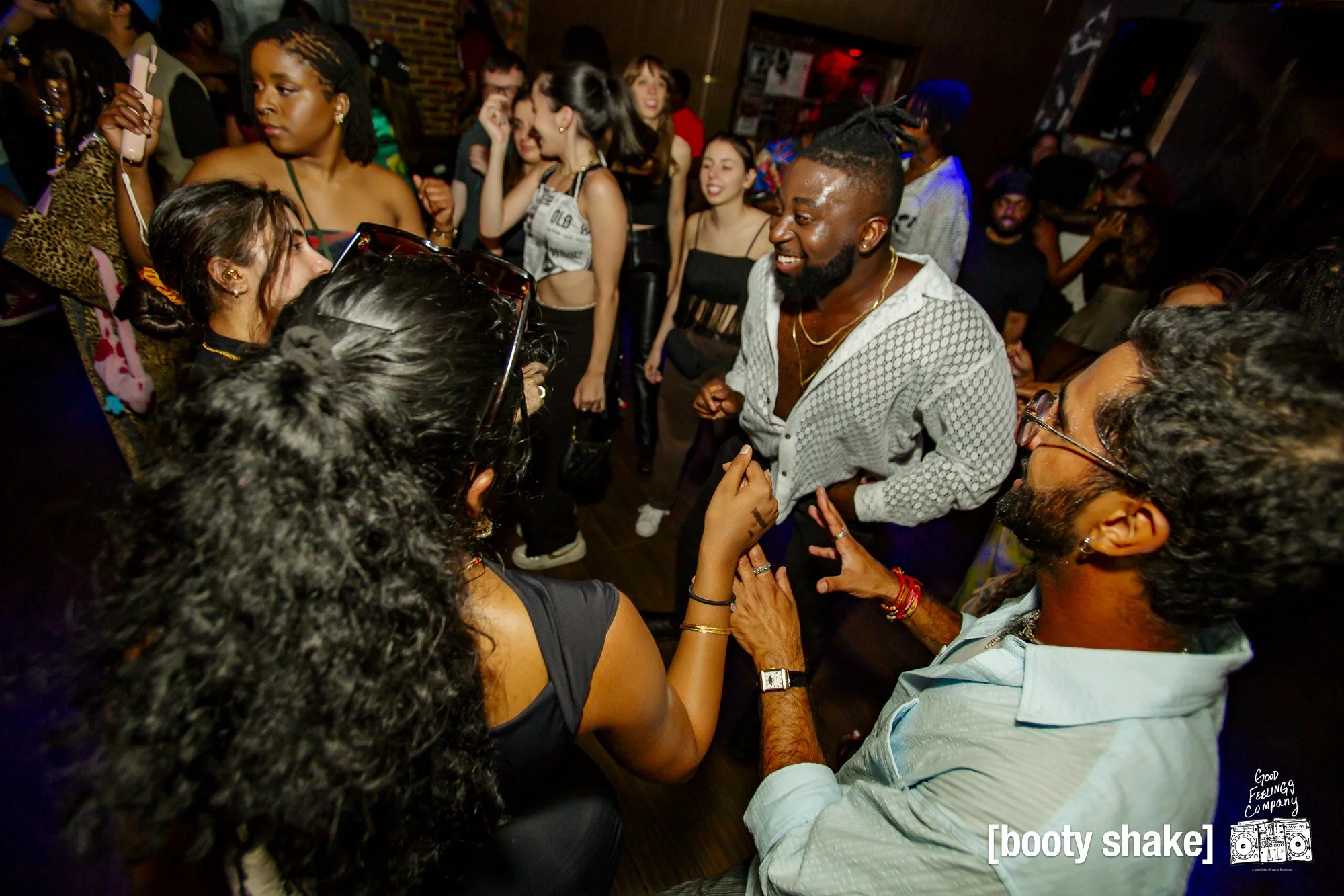 People dancing and having fun at a lively party.