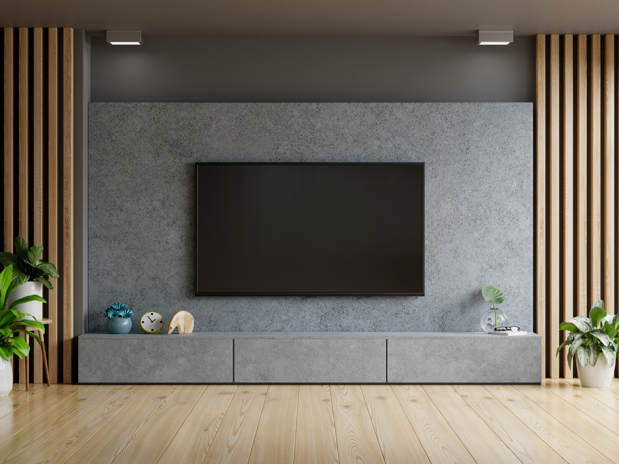 Wall-mounted TV installed above a TV stand on a gray textured accent wall by a professional handyman in Blaine, Minnesota