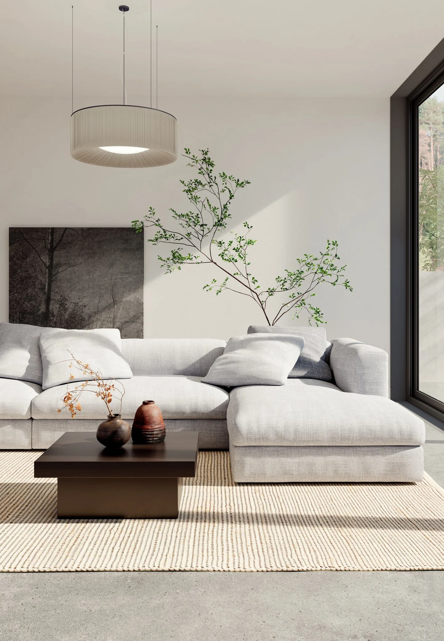 Modern living room with white sofa, black coffee table with two vases, a beige area rug, wall art, a potted tree, large window with black frame, hanging light fixture.