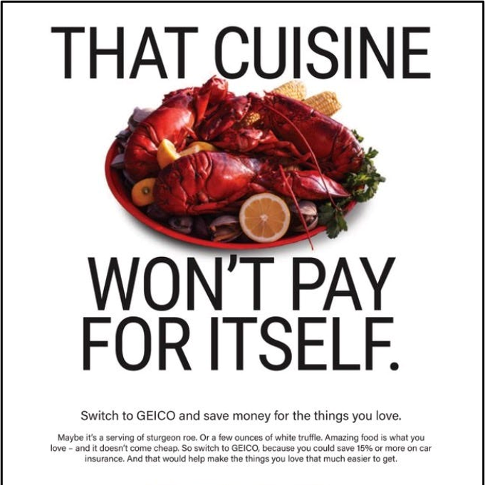 An advertisement with a plate of cooked lobster, lemon, and vegetables. The text says, "That cuisine won't pay for itself. Switch to GEICO and save money for the things you love."