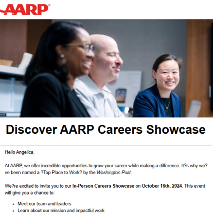 Group of three people sitting at a table, smiling and engaged in a discussion, in a professional setting.