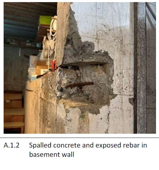 Spalled concrete and exposed rebar in basement wall
