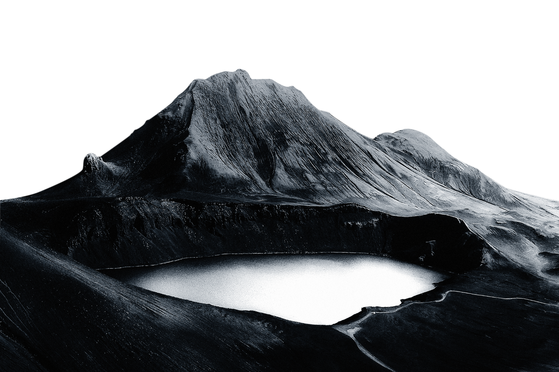 Black and white photo of a mountain with a snow-capped peak, a small lake at the base, and a rugged landscape.