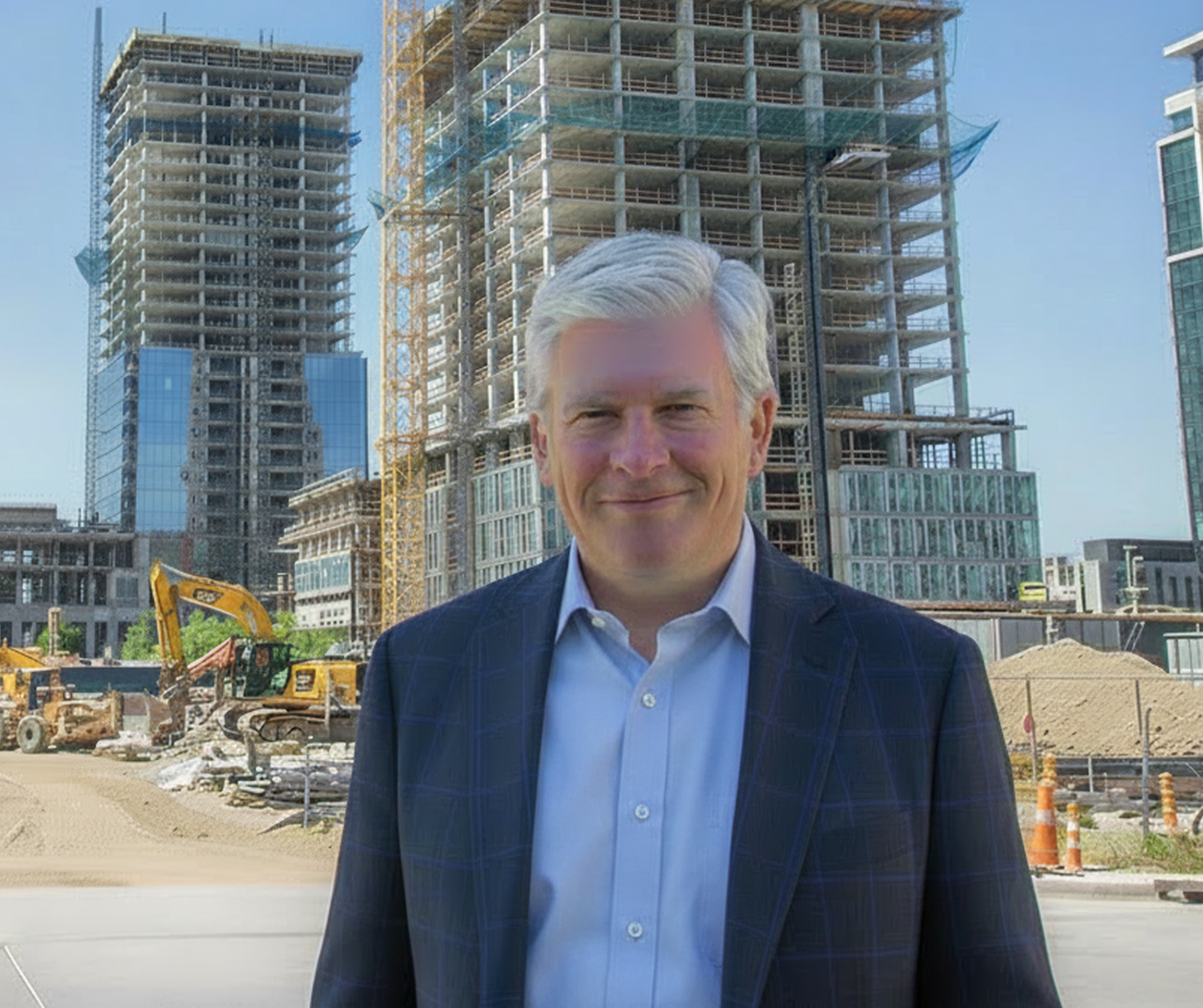 Neil Peek standing at an active construction site with high-rise buildings under development behind him.