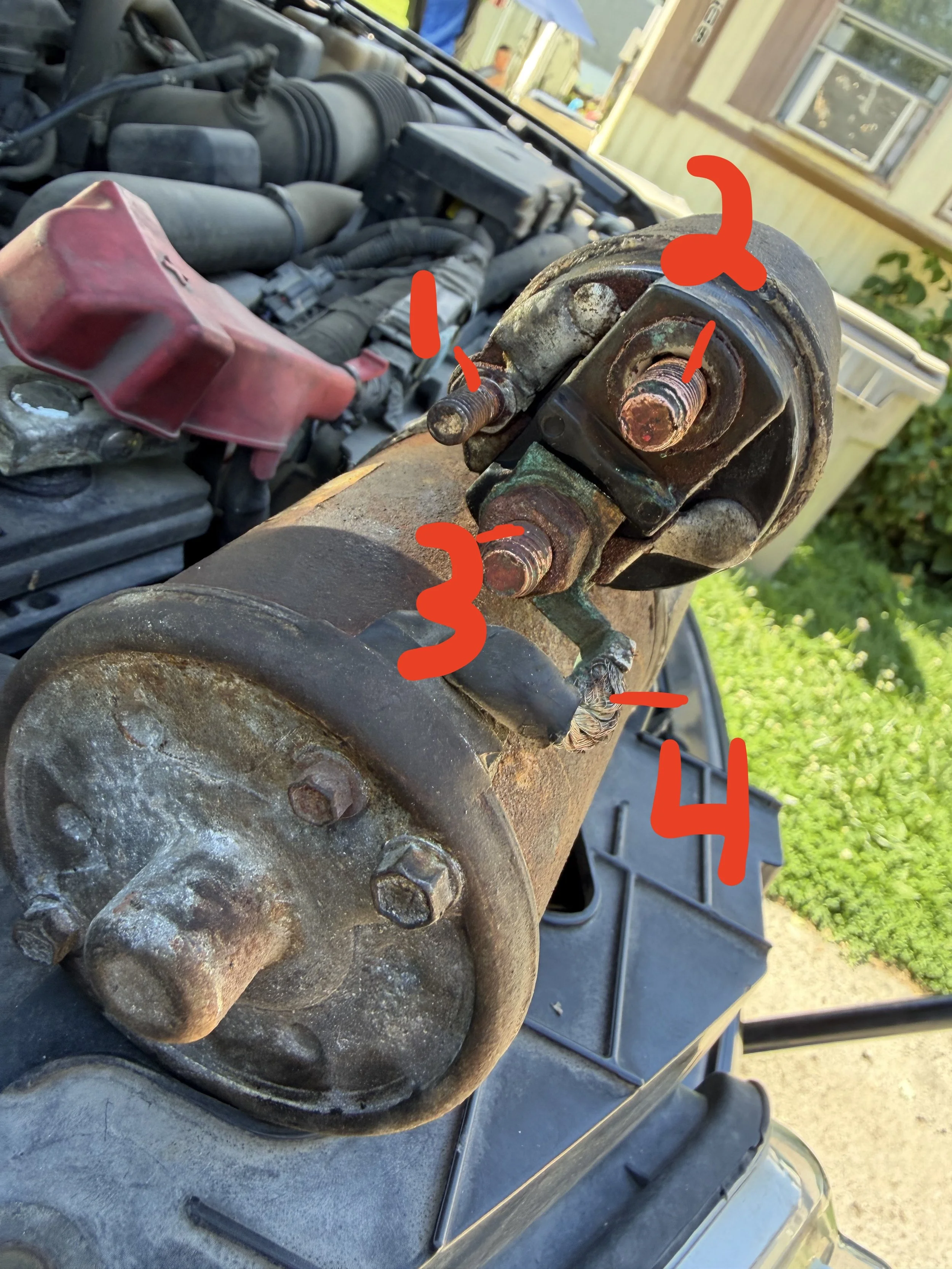 mobile mechanic fort wayne installing a starter. this image shows how to test a starter. mobile mechanic fort wayne performing a mobile starter replacement fort wayne.