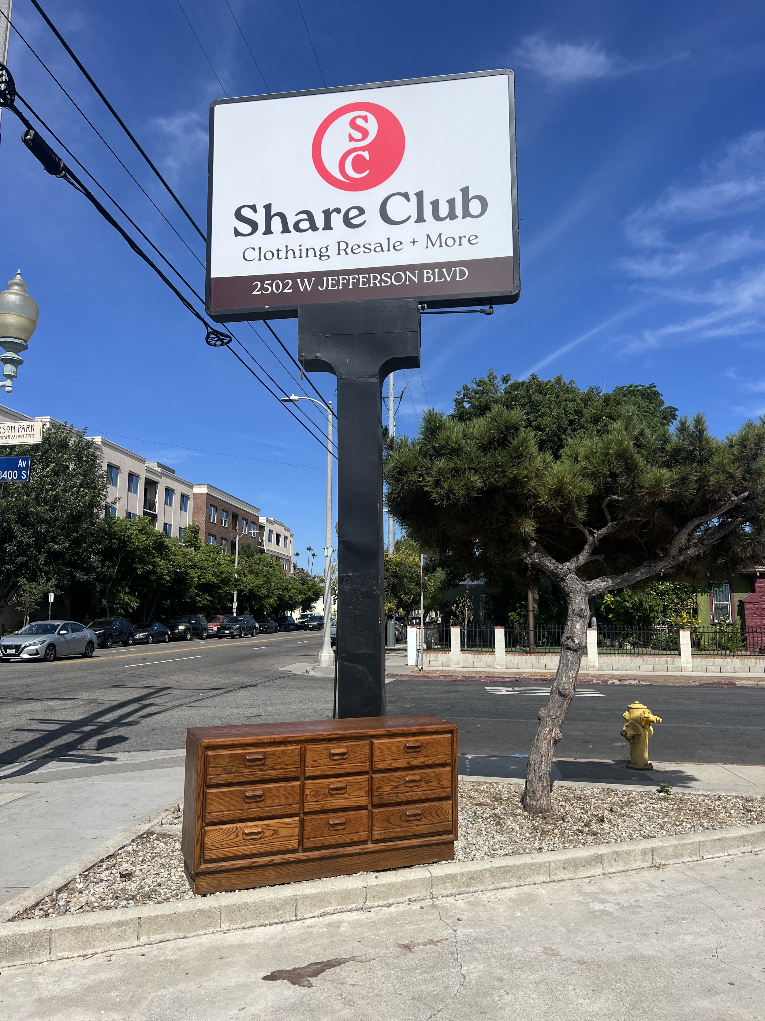 A road sign for Share Club, a thrift store and community space in West Adams / Jefferson Park