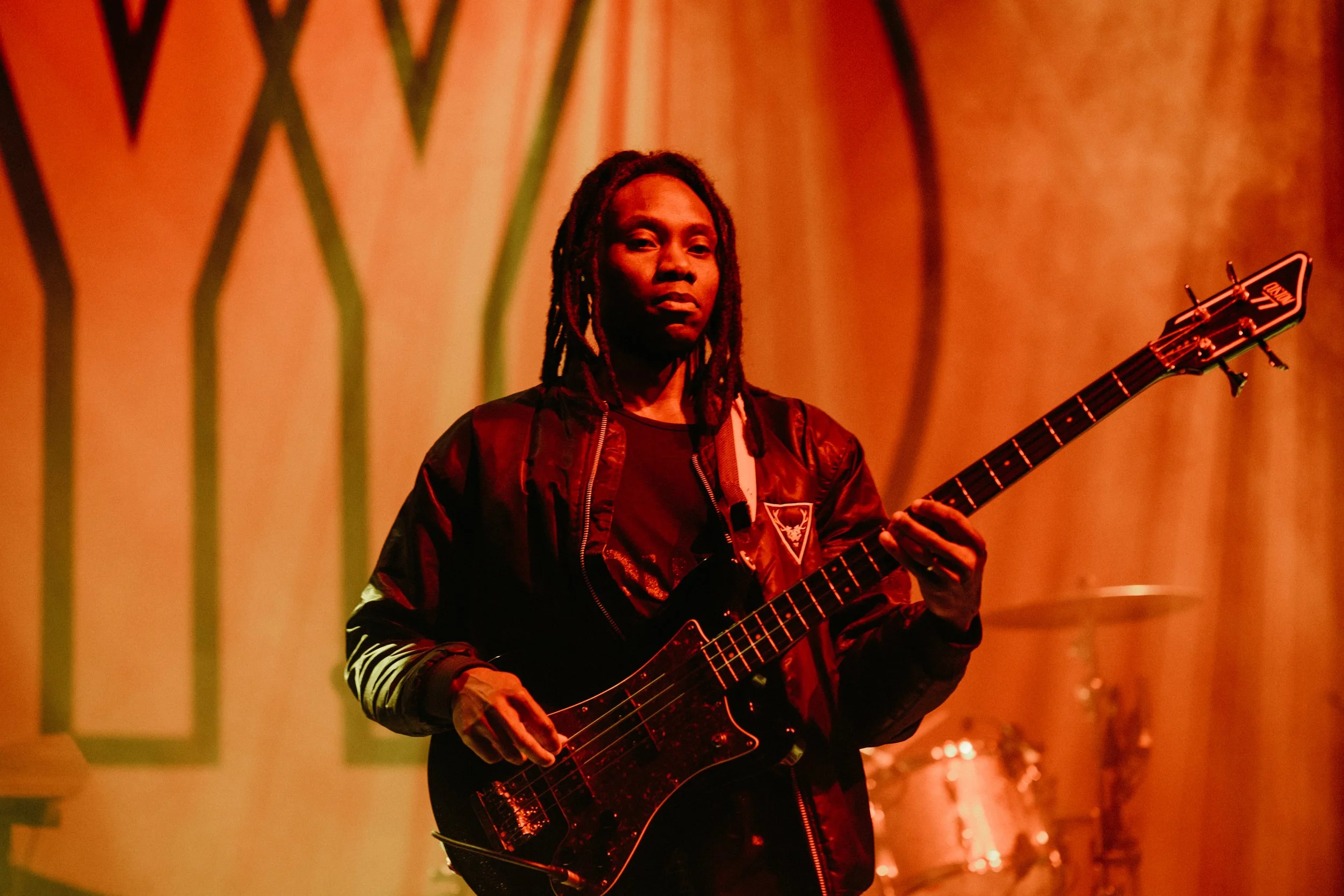 © 2026 LOWRI BURKINSHAW | Olugbenga Adelekan performing with Yannis & The Yaw at O2 Shepherd's Bush Empire 