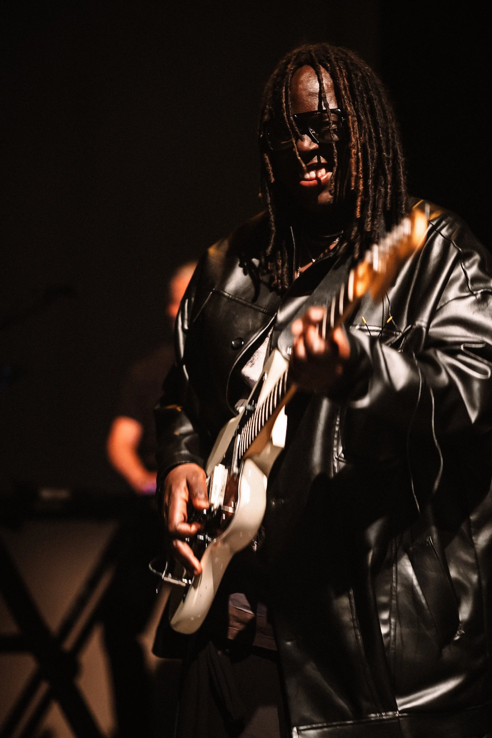 Dave Okumu performing with Yannis & The Yaw at O2 Shepherd's Bush Empire