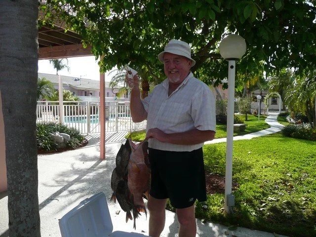 Guest Holding up Fish