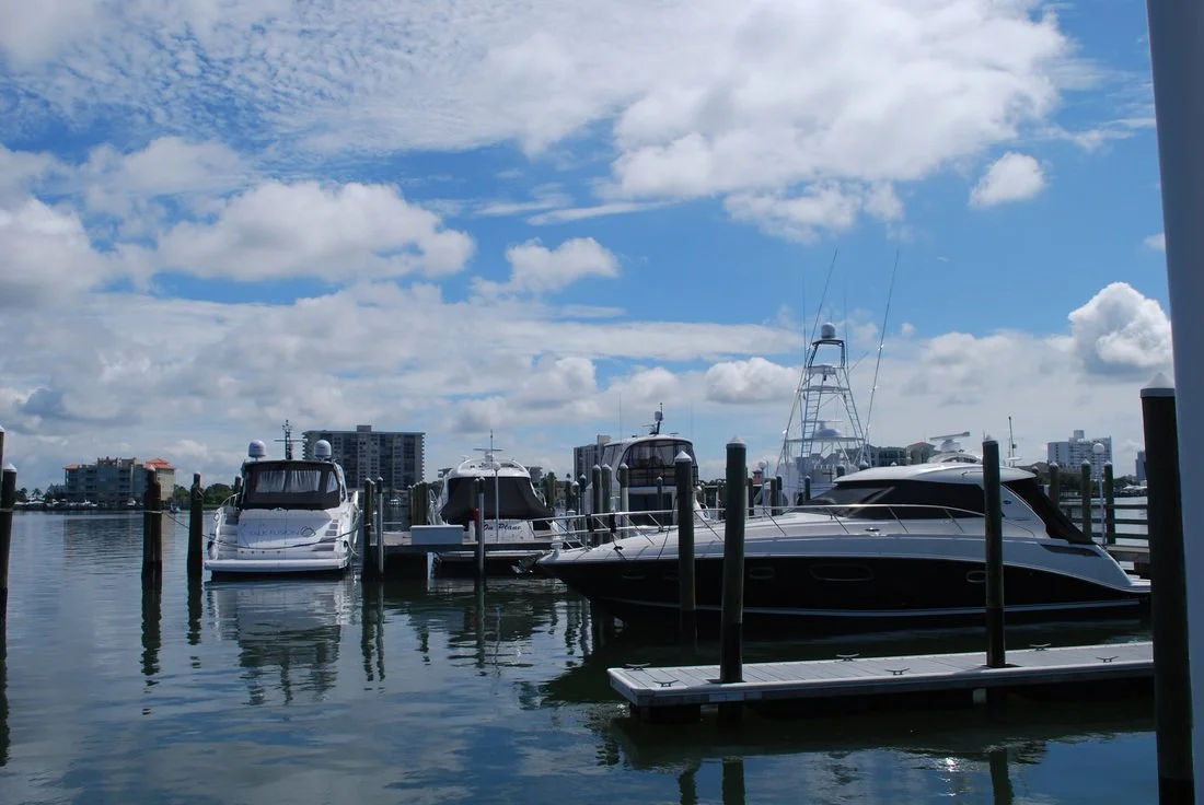 Boats Parked in Slips at Dock