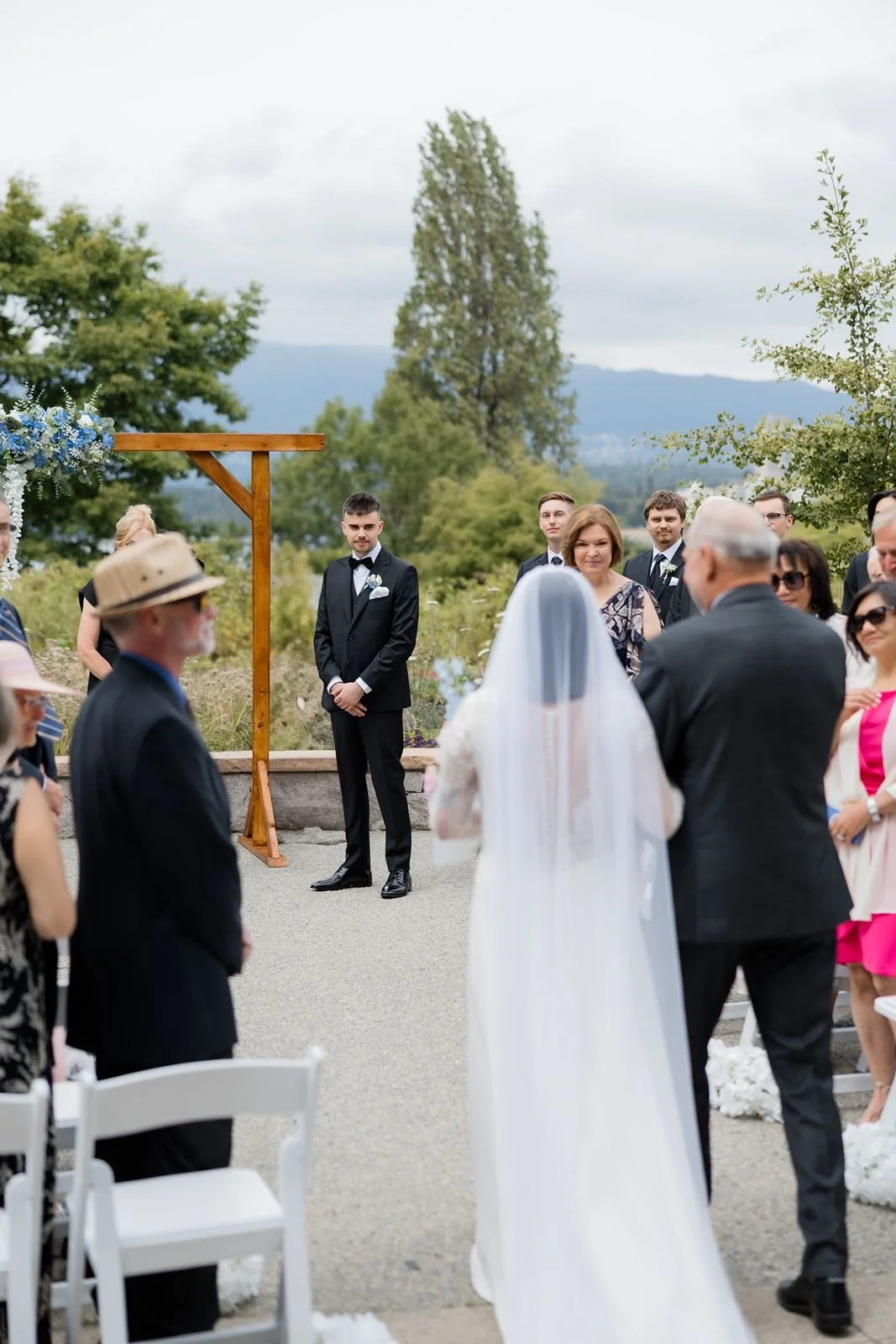  Bride and groom walking down the aisle during their Museum of Vancouver wedding 