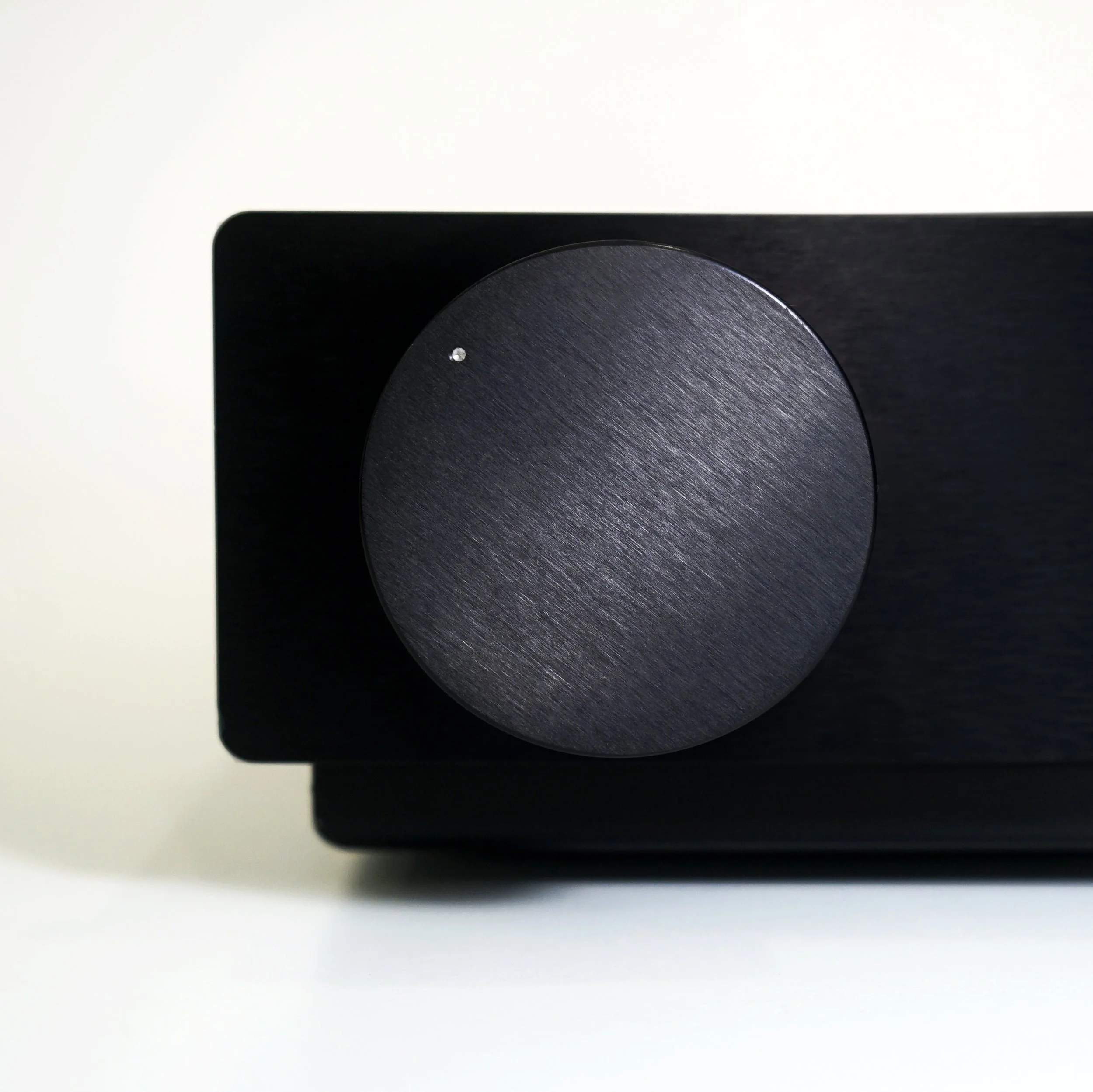 Close-up of a OA21 Legacy  with a large, circular, brushed metal knob on - The ONIX KNOB and ICON  (C)  www.oa21.com