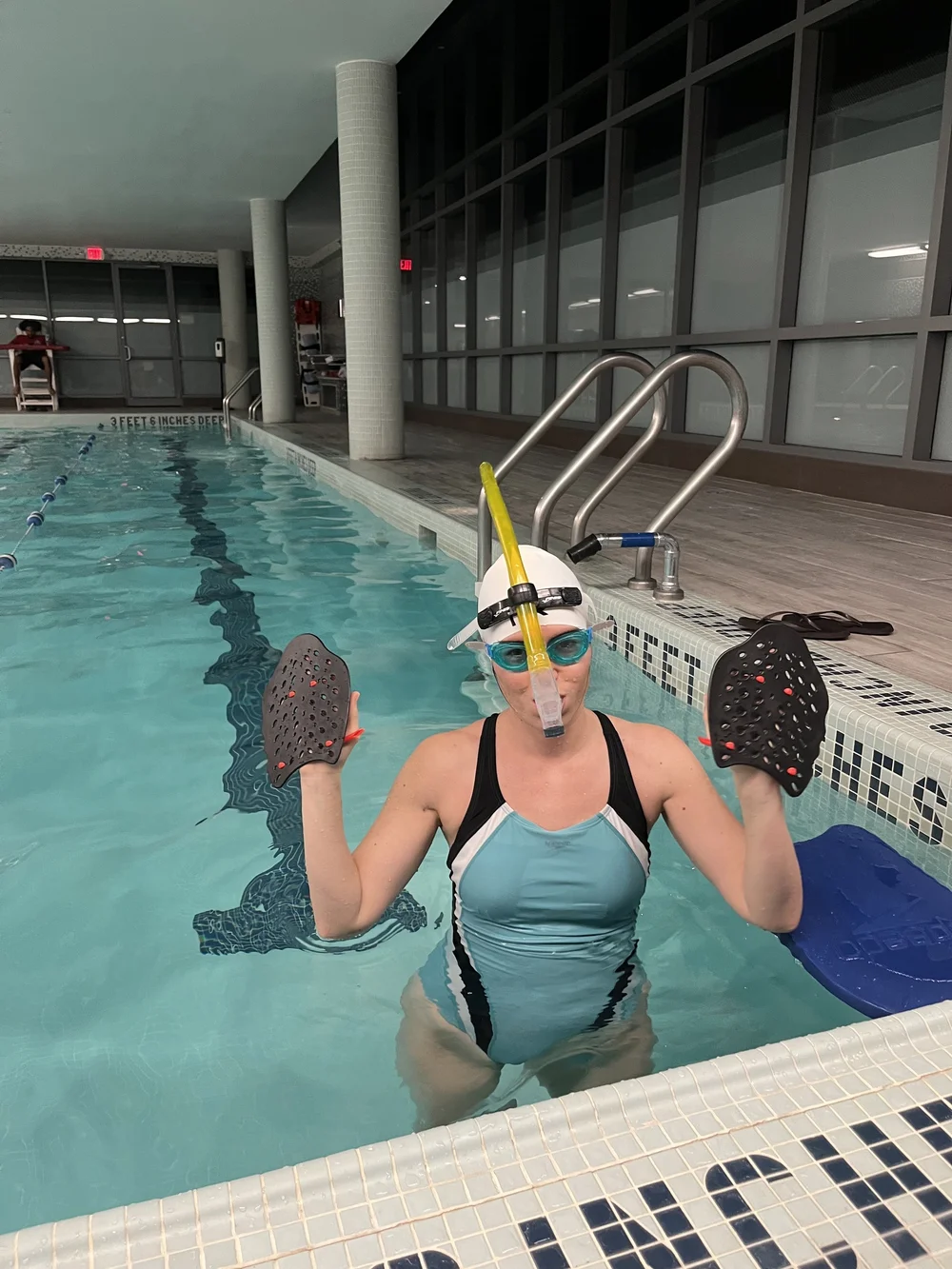 Adult swim lessons with instructor and student