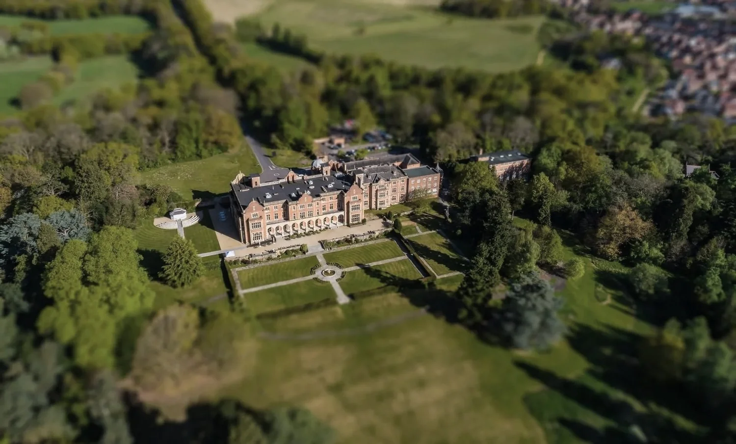 Aerial view of Easthampstead Park and its landscaped Berkshire grounds