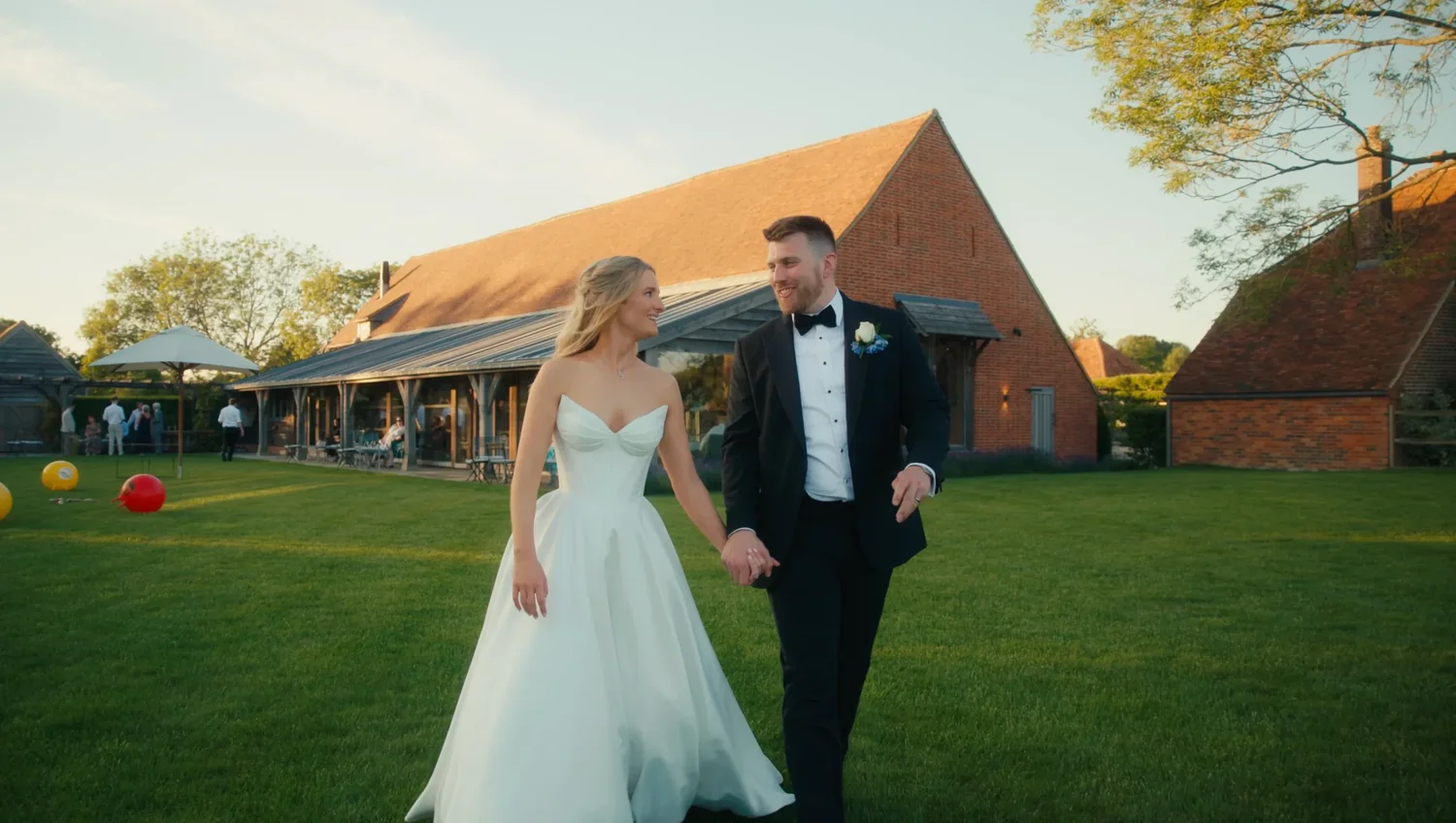 Emily and Ryan enjoying the lawn beside the Rackleys wedding barn