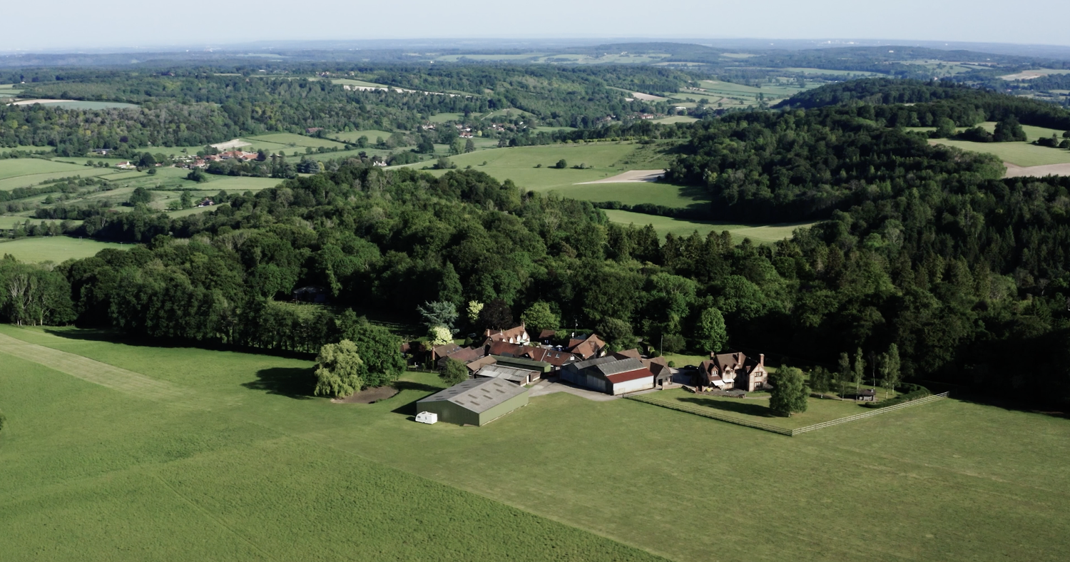 Drone view showing Old Luxters Barn and the surrounding Hambleden Valley