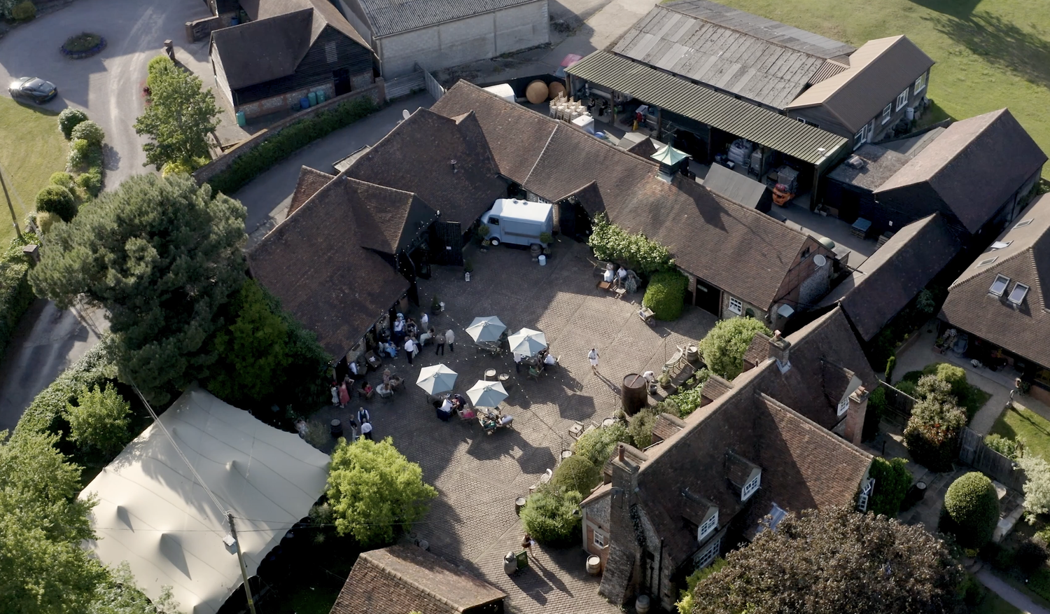 Aerial view of Old Luxters Barn, its courtyard and surrounding Chiltern countryside