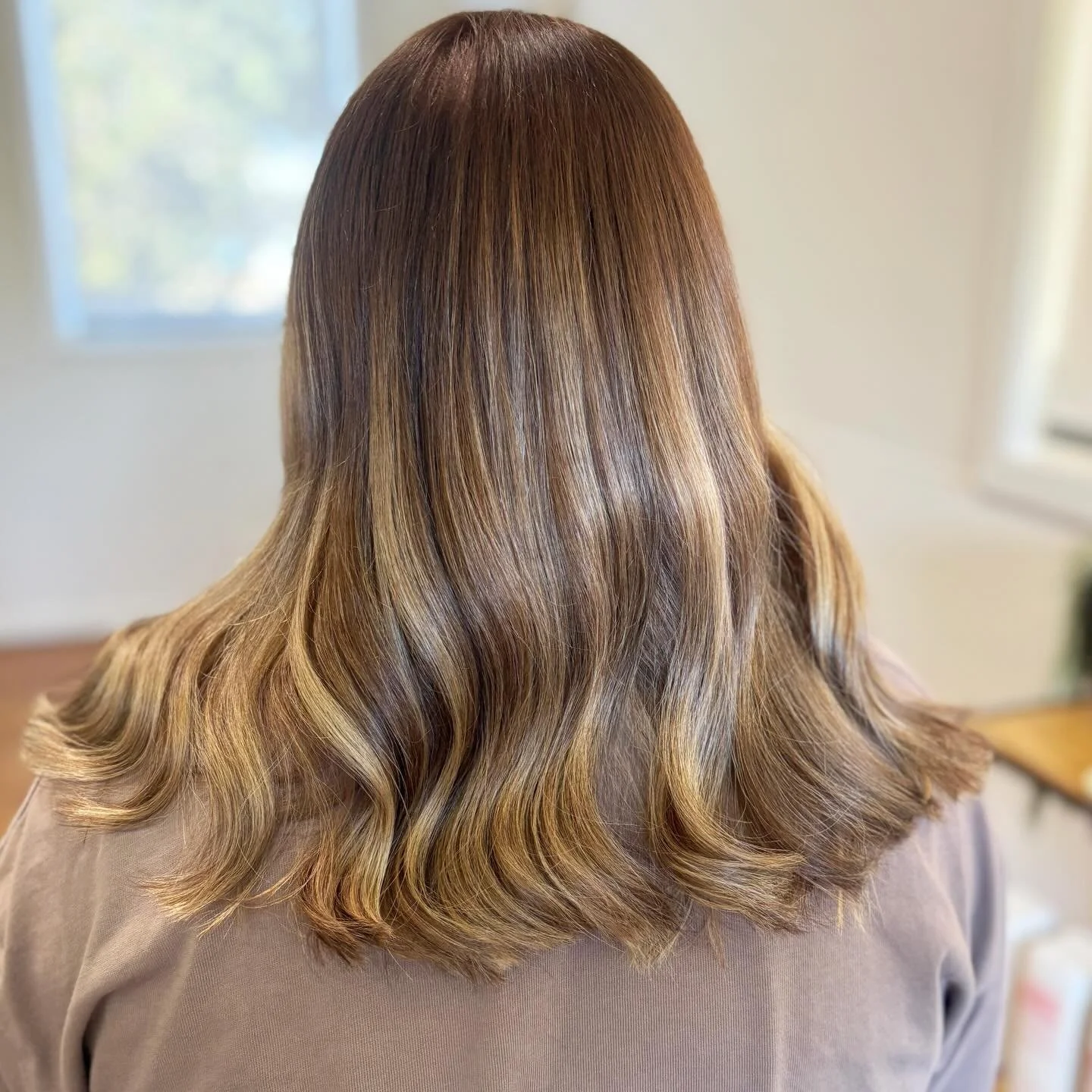 Over being blonde. Understated, but better.
Reverse balayage for Cait &mdash; bringing back depth, softness and a colour that actually grows out beautifully. My lighting isn&rsquo;t doing this justice but I&rsquo;m obsessed 🤎 Book online or DM to ch