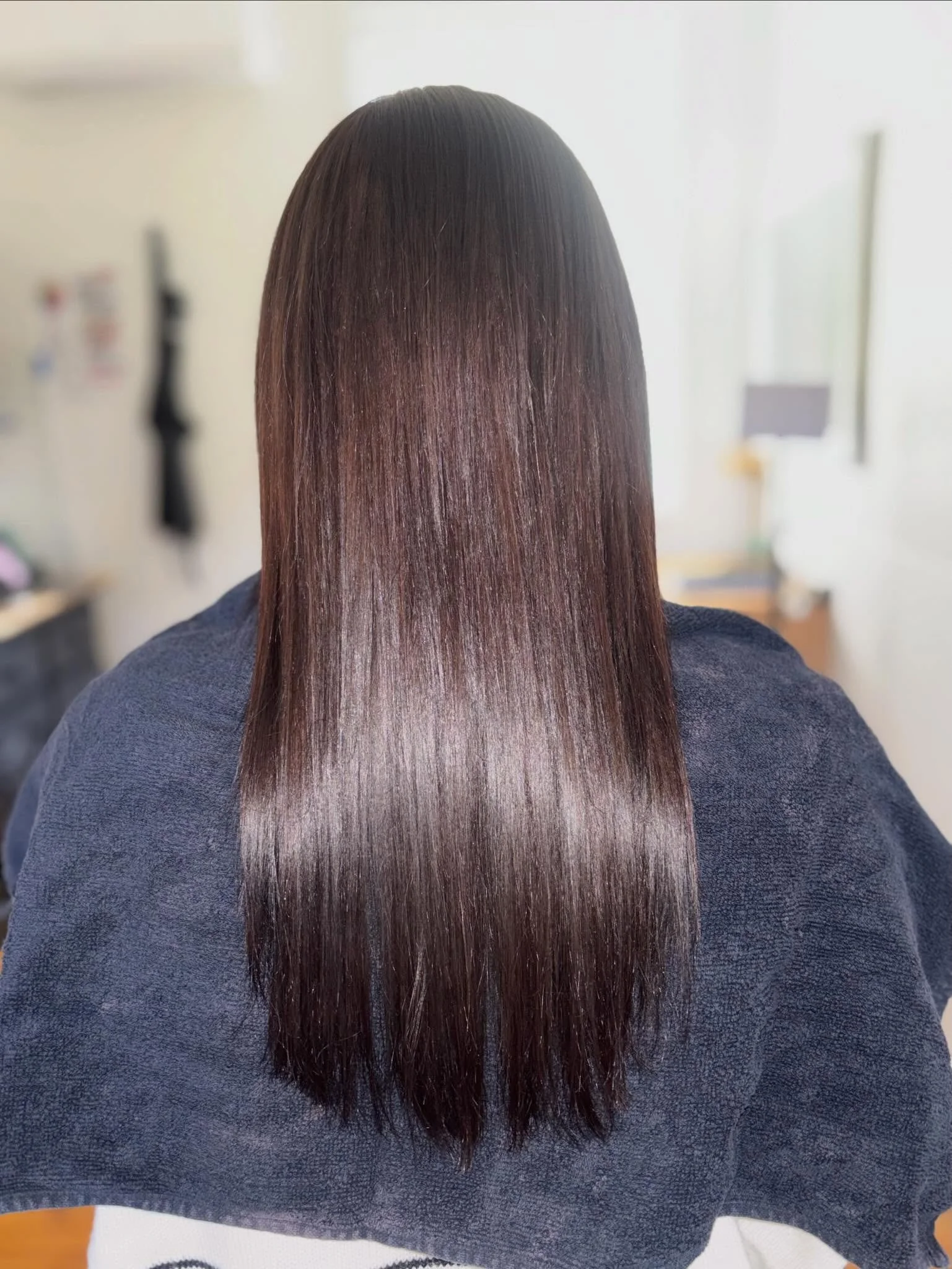 She wasn&rsquo;t missing brightness &mdash; she was missing direction.
We shifted Mads into a deeper brunette and introduced a fringe that completely reframes her face, giving her that effortless, put-together feel without overcomplicating it. Subtle